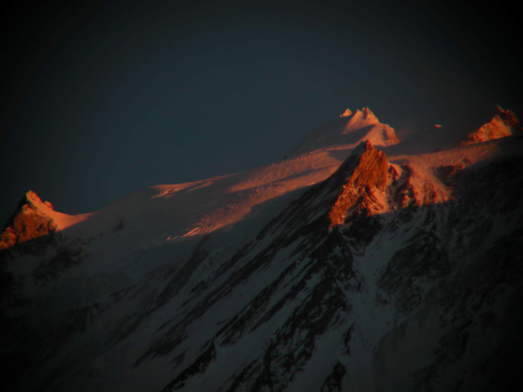Manaslu 09 11 Manaslu Summit Plateau Close Up At Sunset From Bimtang Heres another extremely close up view from Bimtang at sunset of the summit plateau of Manaslu with the East Pinnacle (7992m) on the left and the summit to the right.